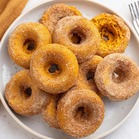 Fluffy vegan pumpkin muffin donuts perfect for autumn breakfast or sweet gatherings.  