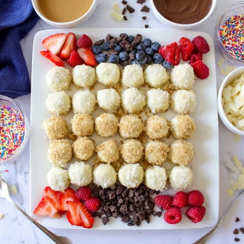 Creamy cheesecake bites arranged beautifully, inviting toppings for endless customizable dessert enjoyment.  