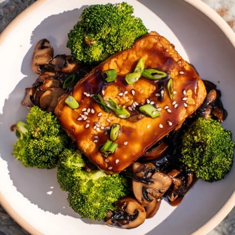 A plant-based culinary delight: this colorful Sautéed Tofu Steak dish presents a perfectly cooked meal.