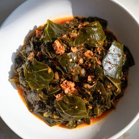 Vibrant green collard greens and tender smoked turkey, a classic Southern recipe, simmering beautifully.