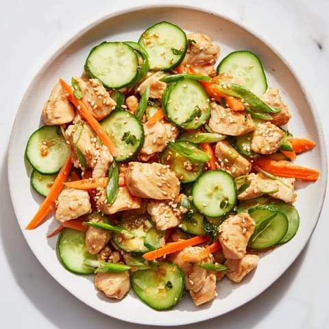 Delicious, fresh deli container shaker chicken salad, showcasing juicy chicken and a perfect blend of Asian flavors.