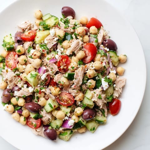 Zesty Tuna Chickpea Salad, showing a close-up of the flavorful ingredients tossed and ready.