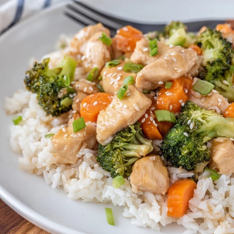 Skillet of One Pan Honey Garlic Chicken Broccoli Rice steaming on a counter, ready for a cozy family dinner.